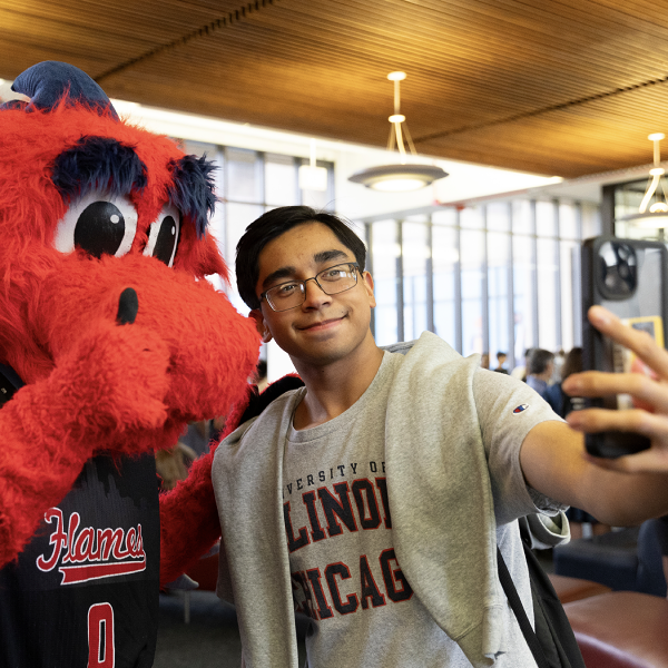 student taking a selfie with Sparky